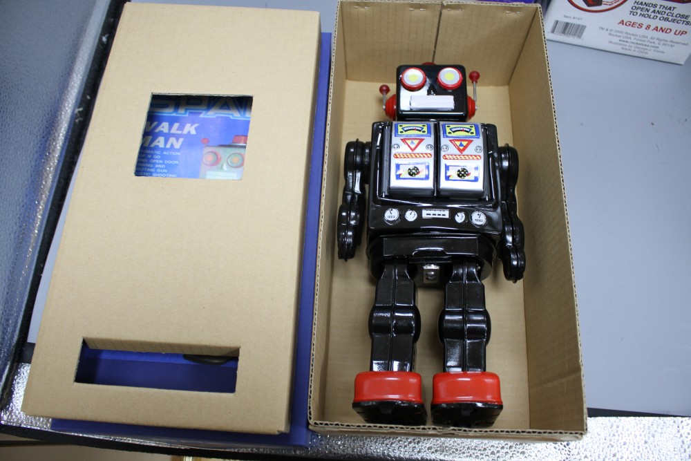 Four collectors robots, various, including a Rocket Toys R-1, two battery-operated ME 100 Space Walk Man (one black, one blue) and a